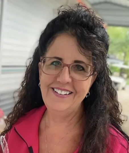Denise Christenson, Certified Functional Nutrition Counselor and founder of Nourish and Thrive LLC, smiling outdoors